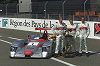 Audi drivers Frank Biela, Tom Kristensen and Emanuele Pirro (from left) with last year''s victory trophy