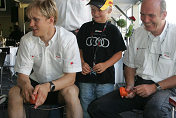 Mattias Ekström, Tom Kristensen (with son Oliver) and Head of Audi Motorsport Dr Wolfgang Ullrich have fun on the Audi slotcar track