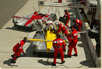 The two Audi works cars during their pitstops