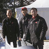 The Audi works pilots (from left) Johnny Herbert, Rinaldo Capello and Christian Pescatori dared riding on ice in the Audi bobsled down the Olympic bob run in St. Moritz