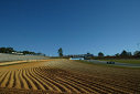 Cars speed past the plowed gravel traps at Road Atlanta