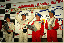 Johnny Herbert (left) and Tom Kristensen (2nd from left) on the podium