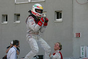 Tom Kristensen celebrates on the roof of his Audi A4 DTM