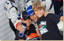 Emanuele and his sons before the podium