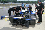 The Dyson Racing crew makes adjustments to its Lola-MG Prototype during Tuesday's American Le Mans Series testing session at Road Atlanta.