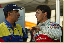 Rinaldo Capello (right) talks to a Michelin technician