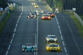 A pack of cars battle down the Mulsanne Straight during the running of the 71st 24 Hours of Le Mans in France