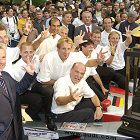 Motorsport fans celebrate the Le Mans success. Together with the winners trophy, which after the third successive Le Mans victory remains in Ingolstadt forever: The winning drivers (in the middle Frank Biela) with Head of Audi Sport Dr Wolfgang Ullrich (middle below) and chairman of the board AUDI AG Dr Martin Winterkorn (right back), Dr Jochem Heizmann, member of the board production (left back) and Dr Werner Mischke, member of the board technical development (front left)