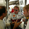 Frank Biela and Emanuele Pirro talking with their race engineer Hans Sauter