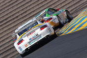 GT cars turn hard right in Turn 2 at Infineon Raceway