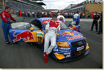 Claudia Pechstein in front of the Abt-Audi race taxi