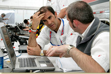 Emanuele Pirro with the race engineer of the #1 Audi